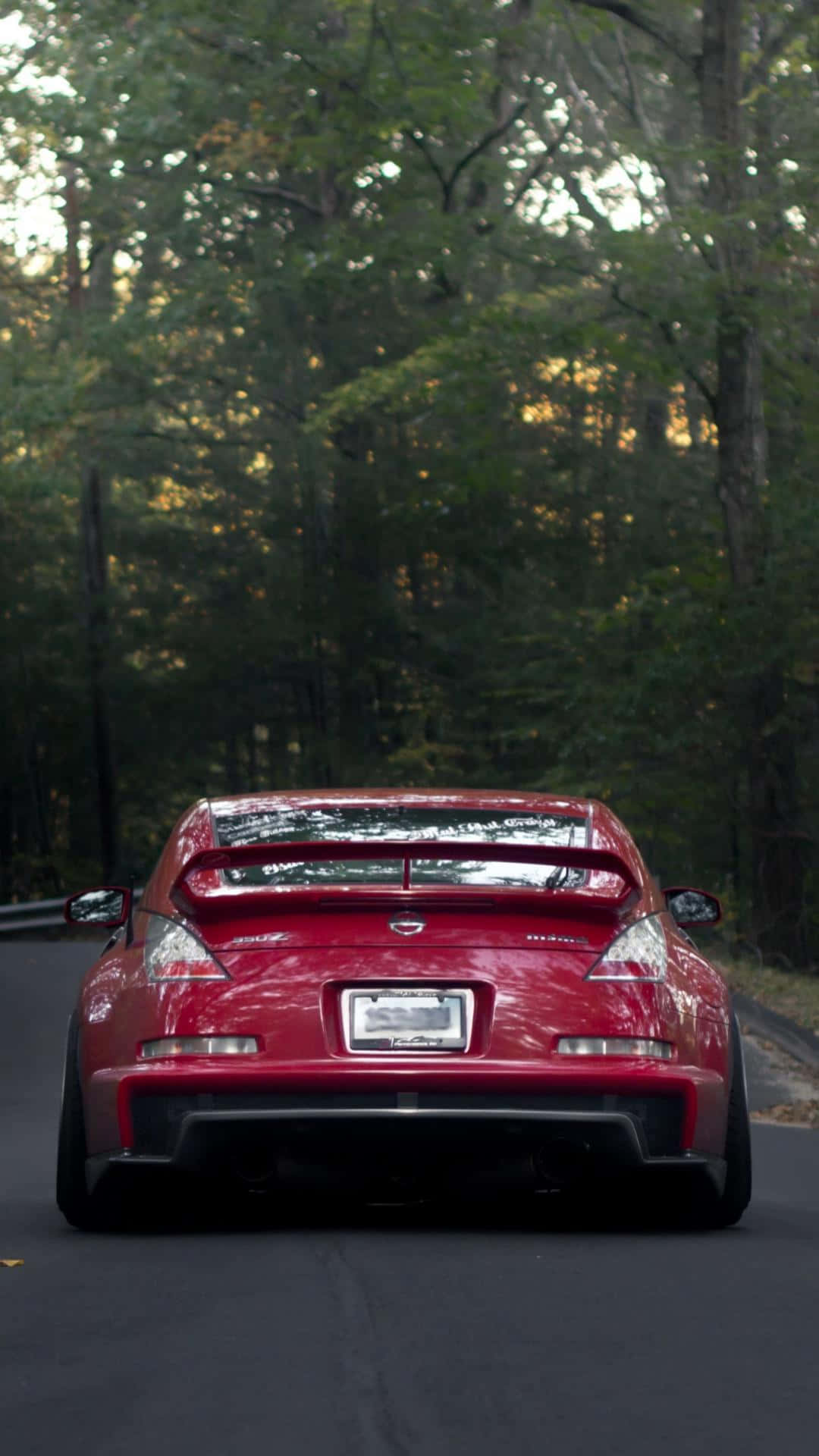 Nissan 350z: The Sleek, Stylish Sports Car For The Modern Driver Background