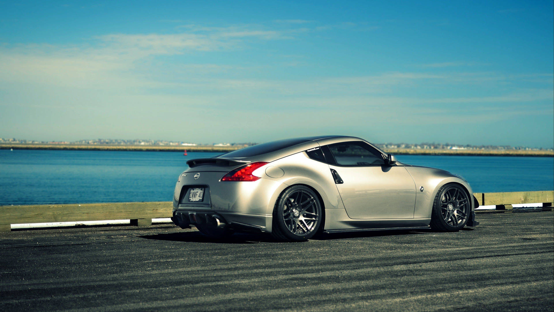 Nissan 370z With A Lake Background