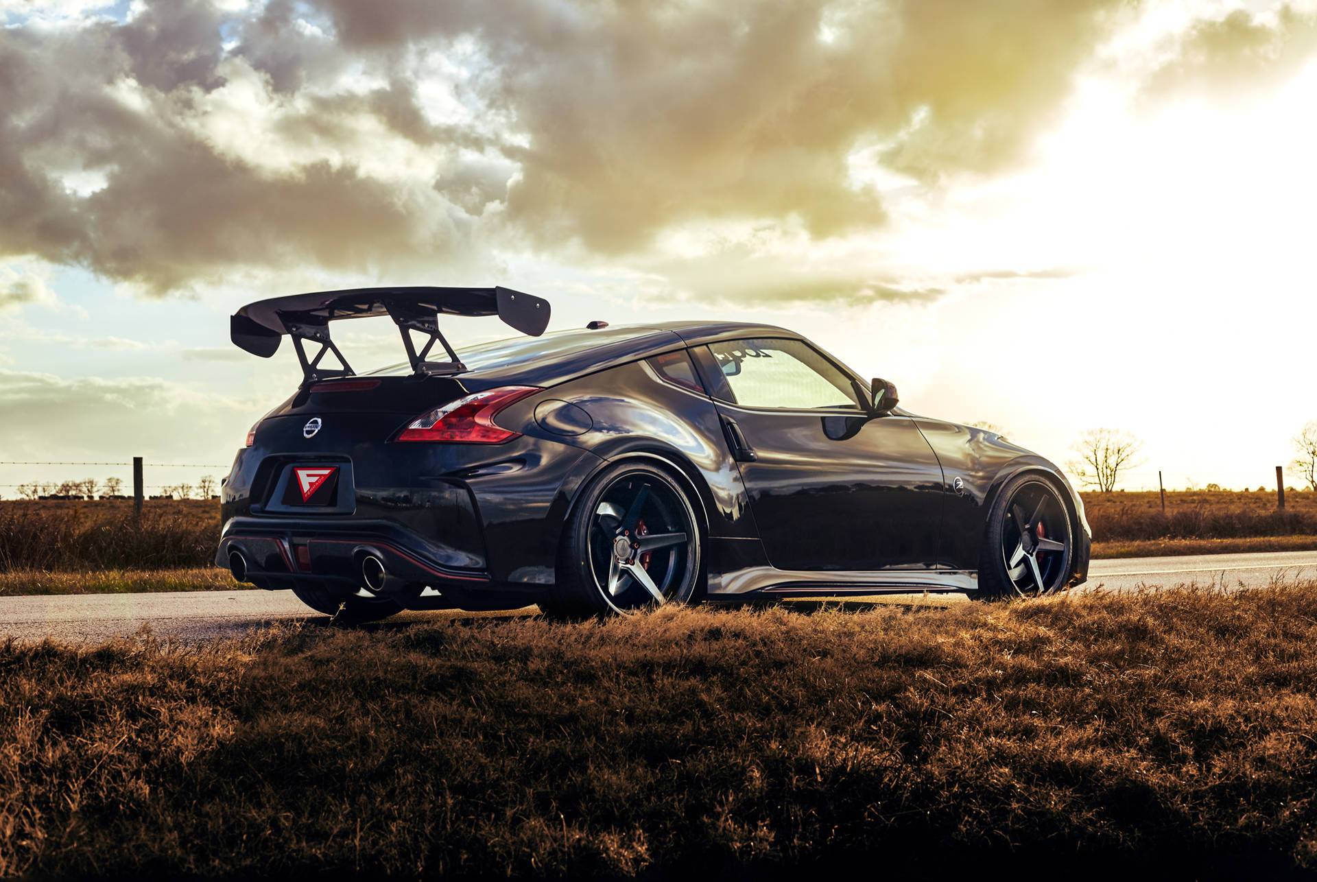 Nissan 370z With A Spoiler Background