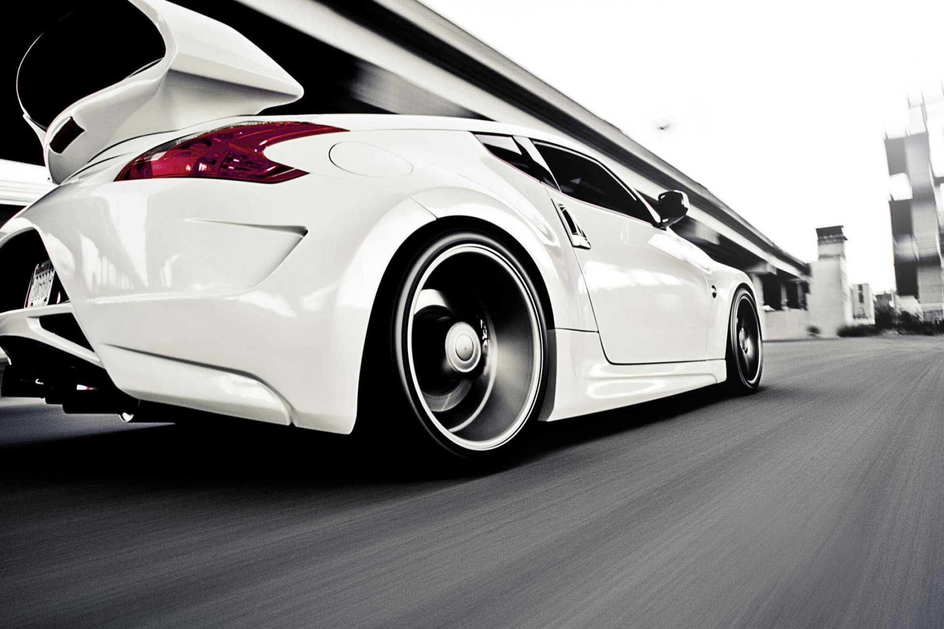 Nissan 370z With An Elevated Highway Background