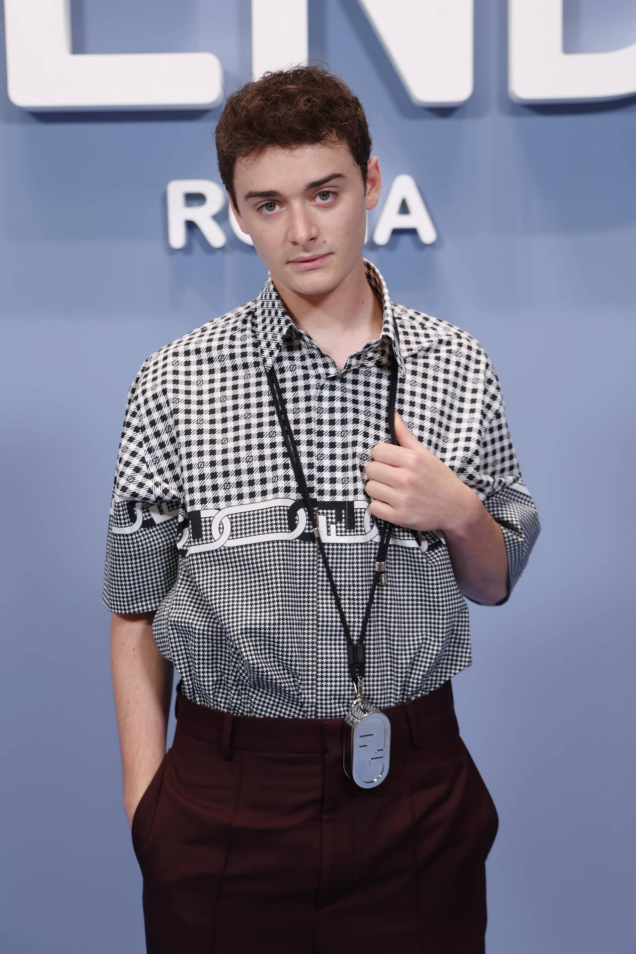 Noah Schnapp At Fendi Fashion Show Background