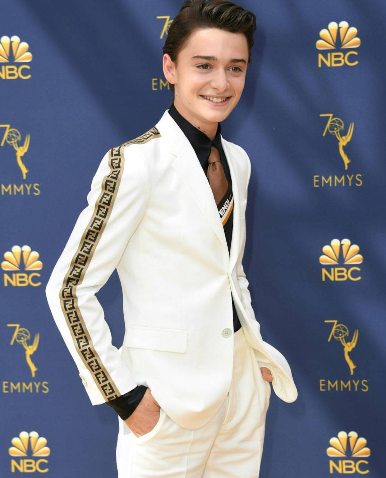 Noah Schnapp In White Suit Background