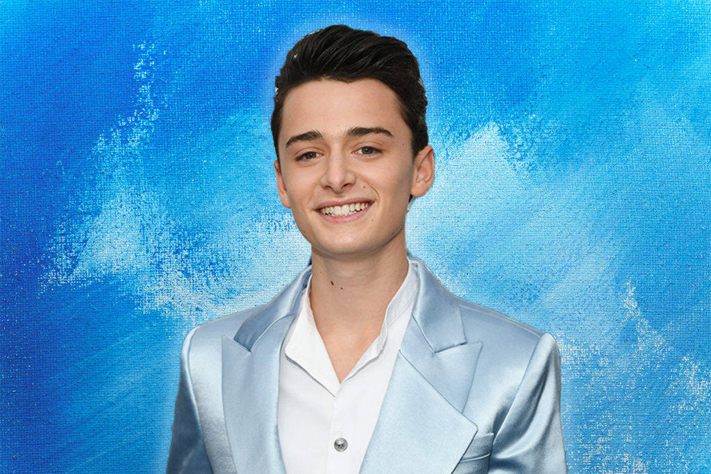 Noah Schnapp Smiling Against Blue Abstract Background Background