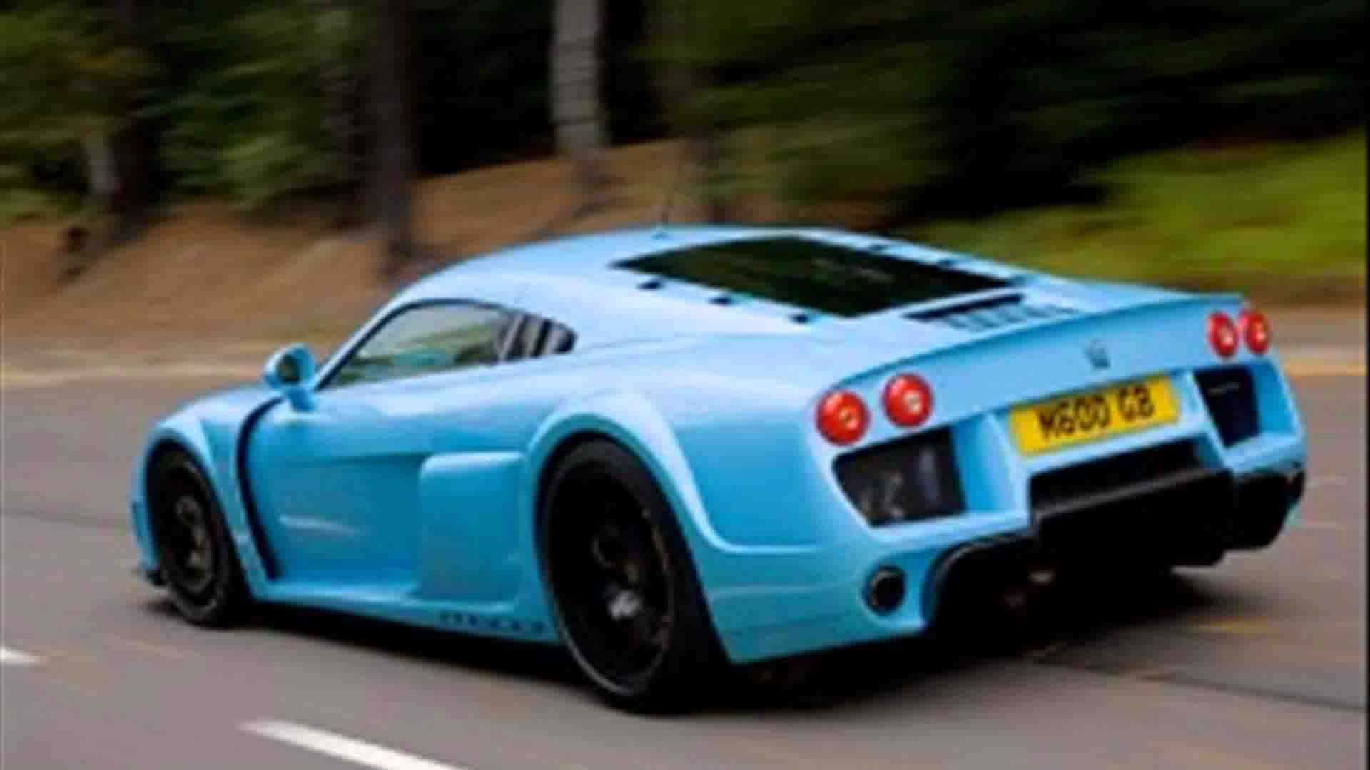 Noble Car Speeding Down Highway Background