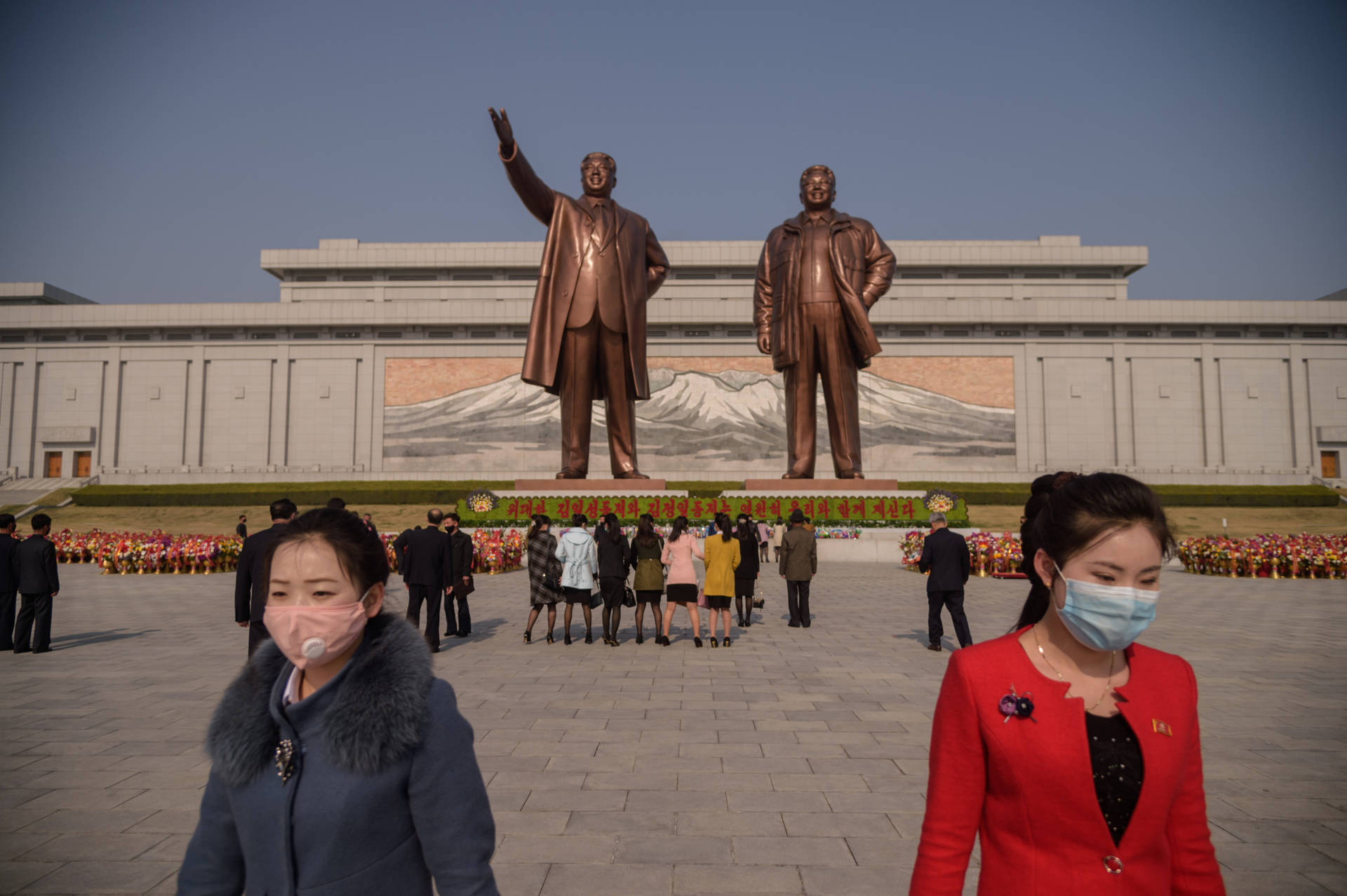 North Korea Citizens Wearing Masks Background