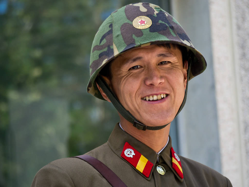 North Korea Soldier With Big Smile Background