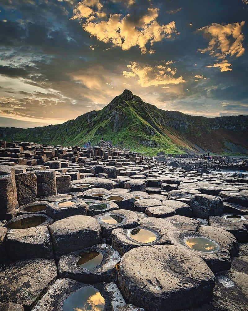 Northern Ireland Giant's Causeway Dark Thick Clouds Background