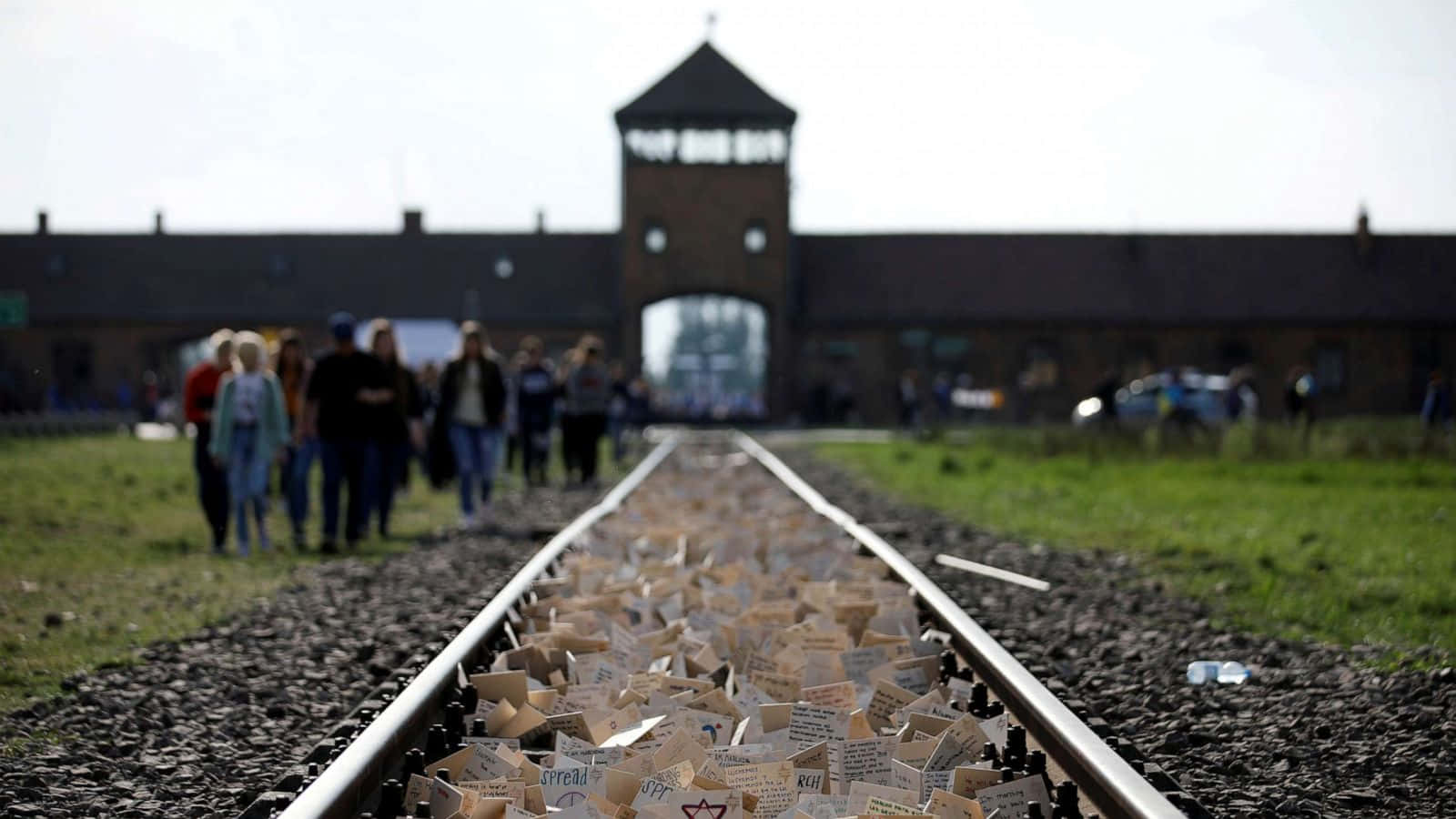 Notable Auschwitz Tracks Covered With Notes Background