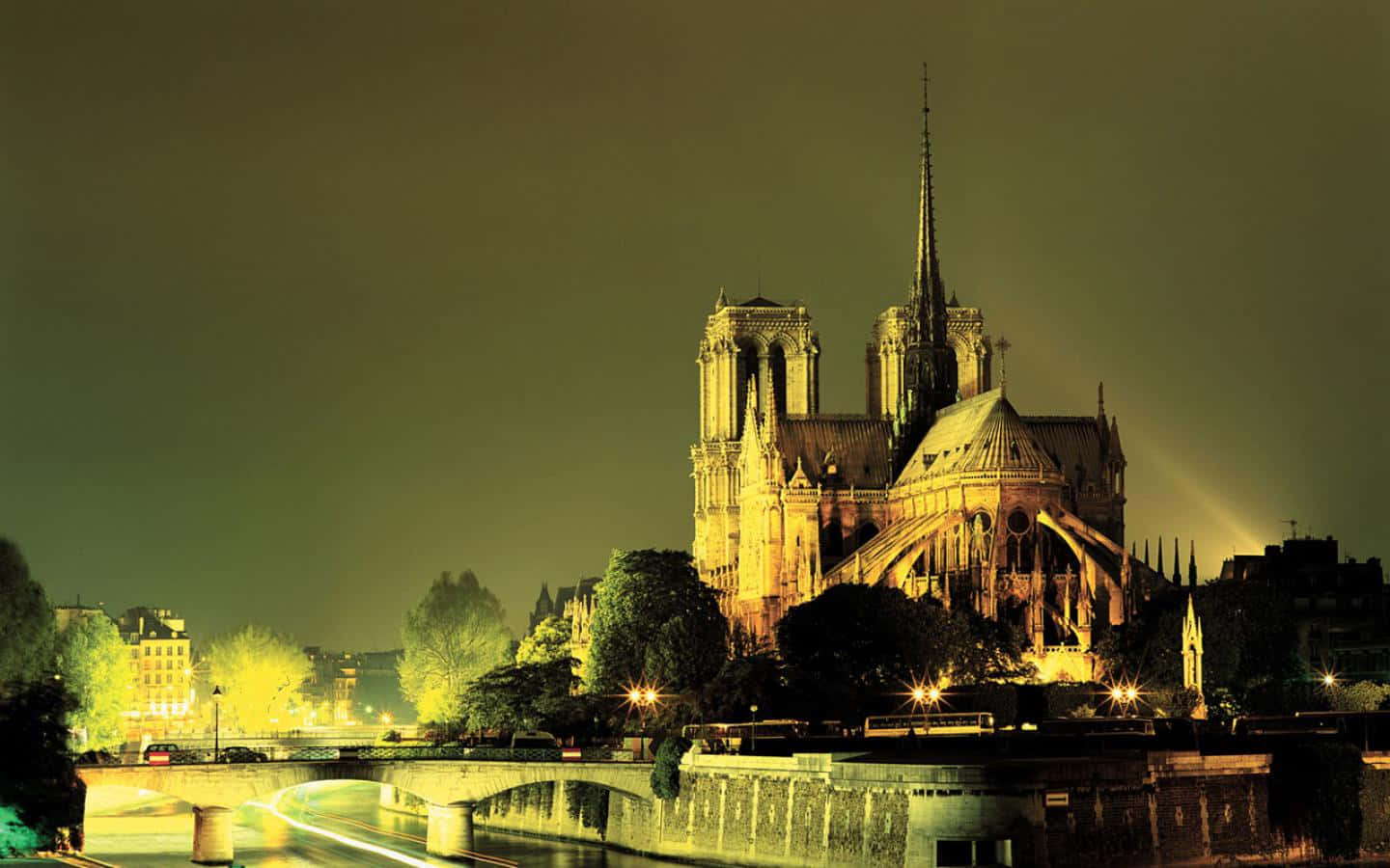 Notre Dame Cathedral Lit With Green Light Background