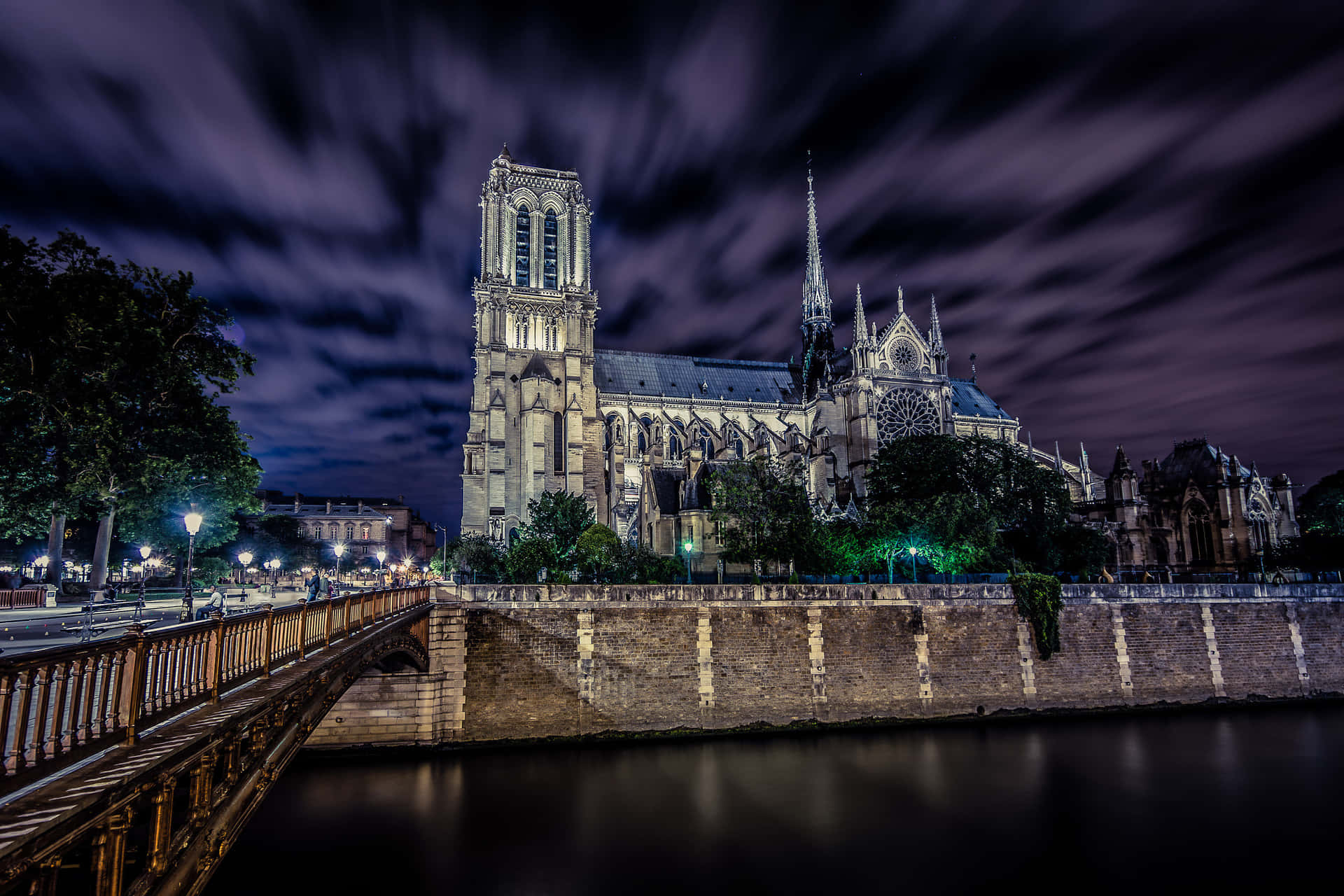 Notre Dame Cathedral Under The Dark Clouds Background