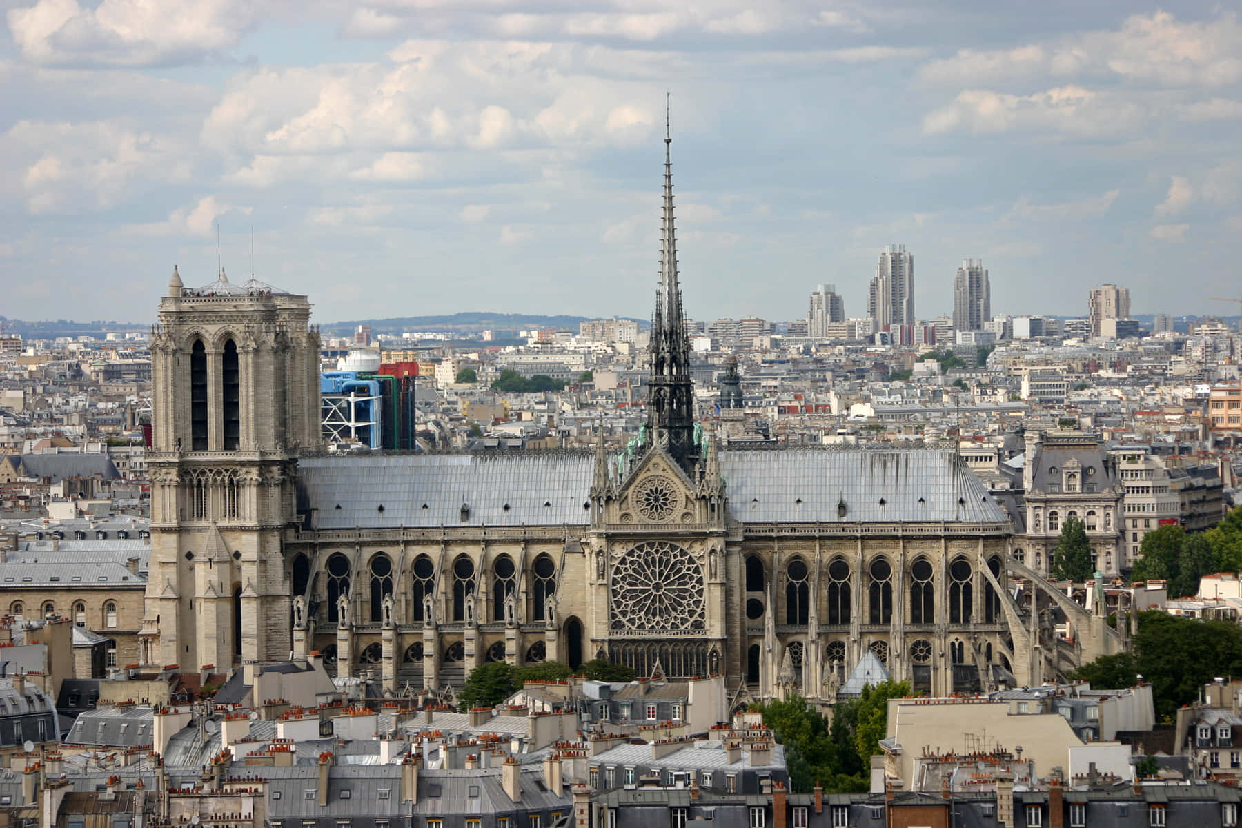 Notre Dame Cathedral With Grey Paris Buildings Background