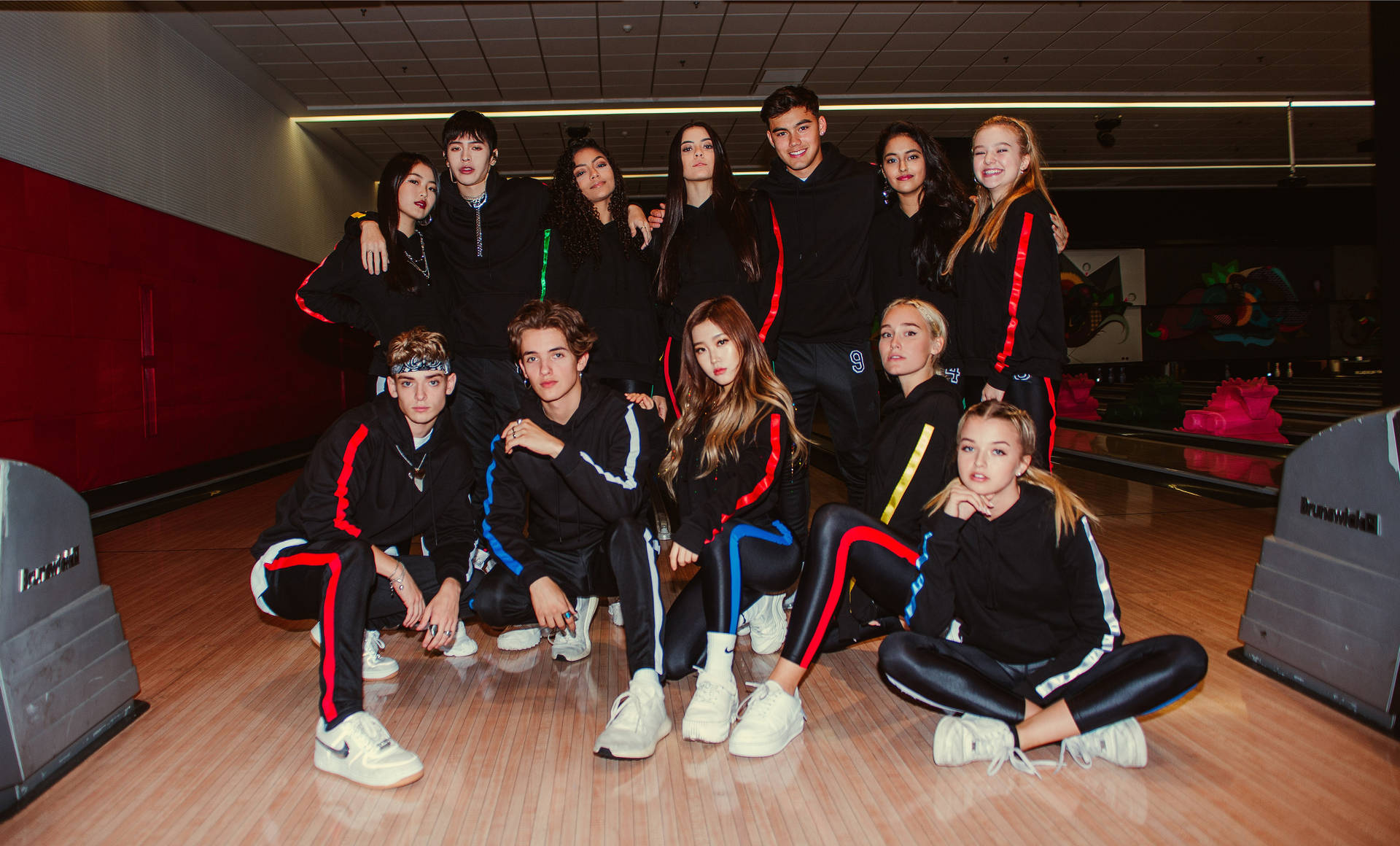 Now United In Black Tracksuits