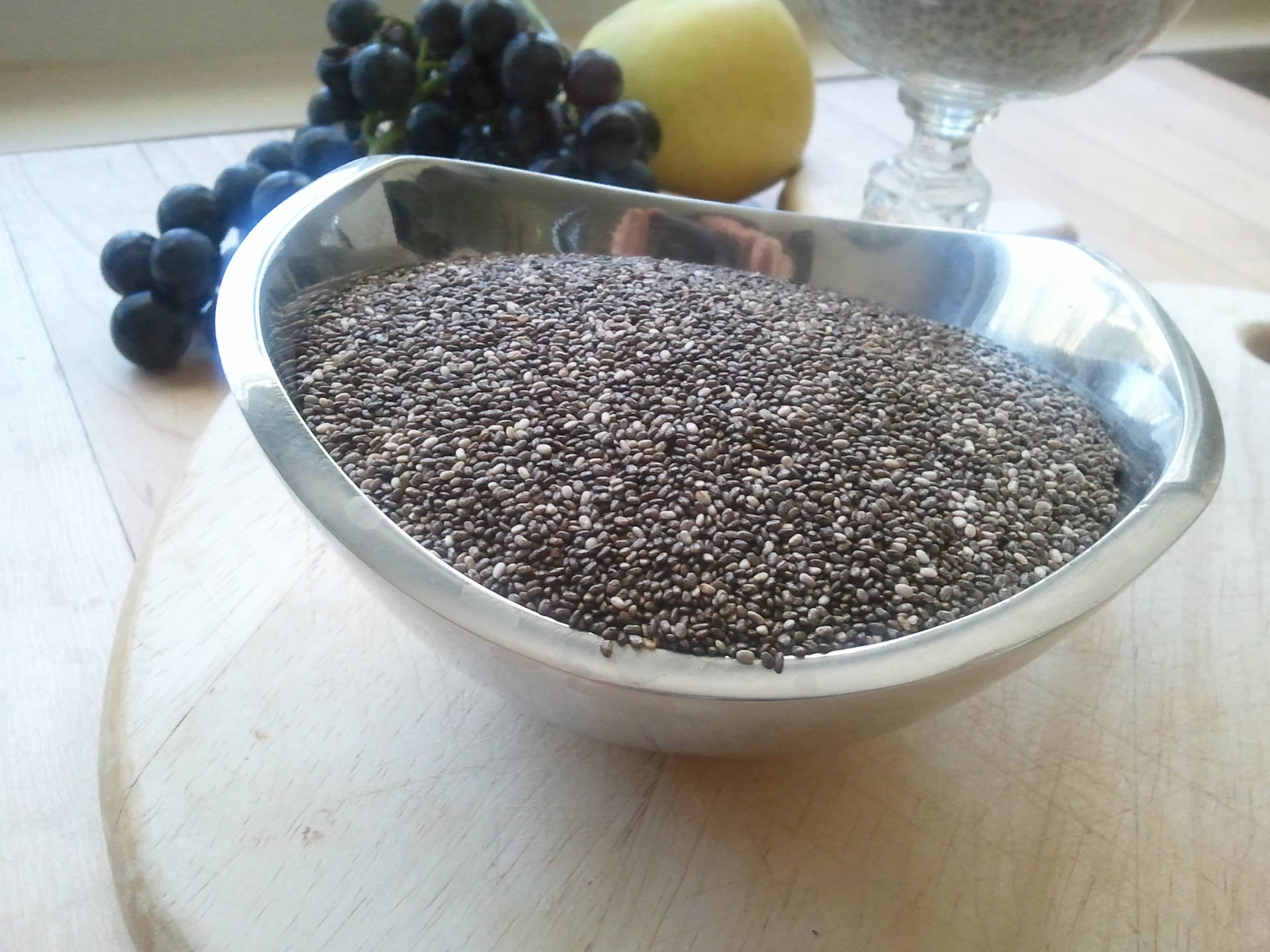 Nutritious Chia Seeds In A Metallic Container Background