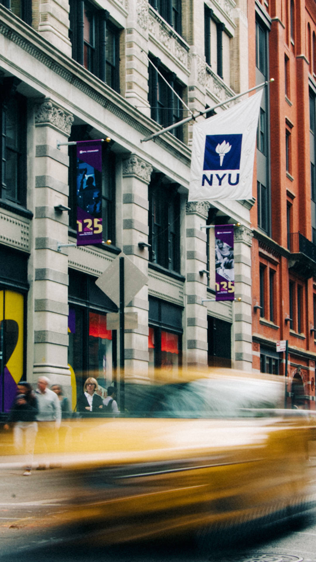 Nyu Banners And Speeding Cars Background