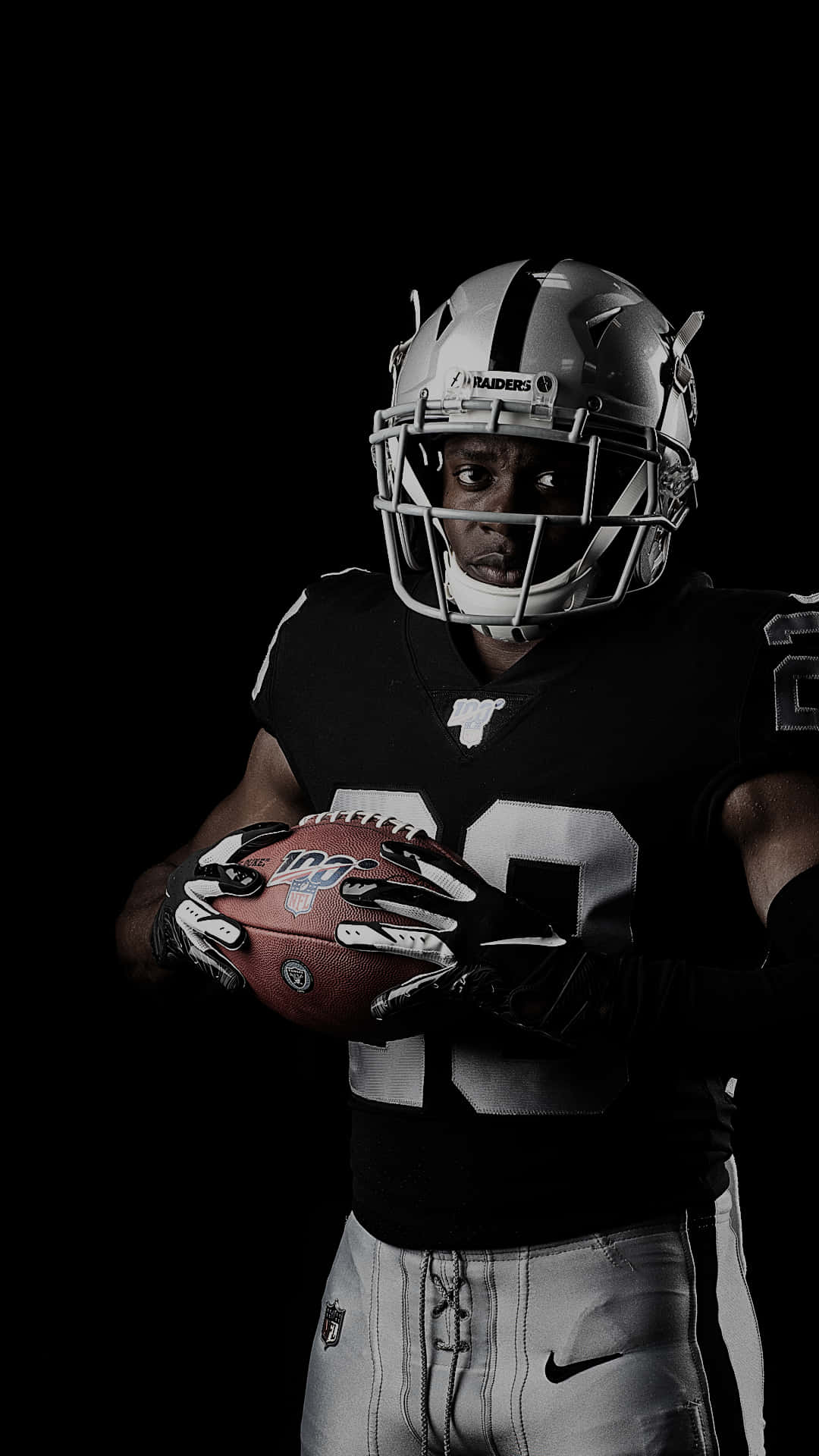 Oakland Raiders Holding Ball Background