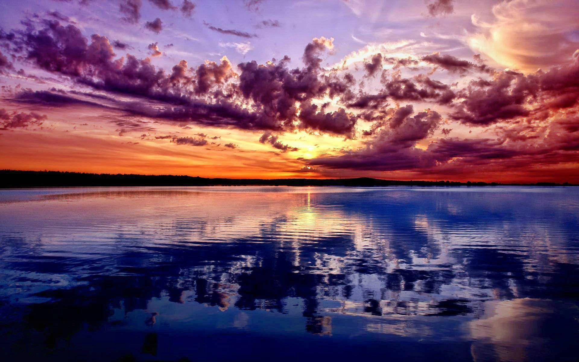 Ocean Sunset Purple Clouds Background