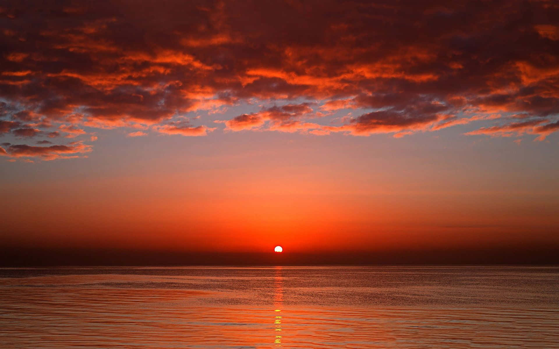 Ocean Under Red Evening Sky Background