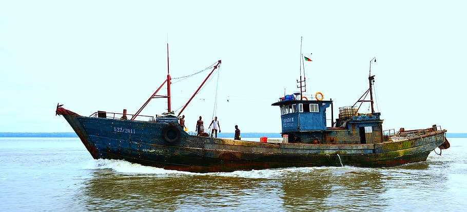 Old Boat Sailing In Wouri River Cameroon Background