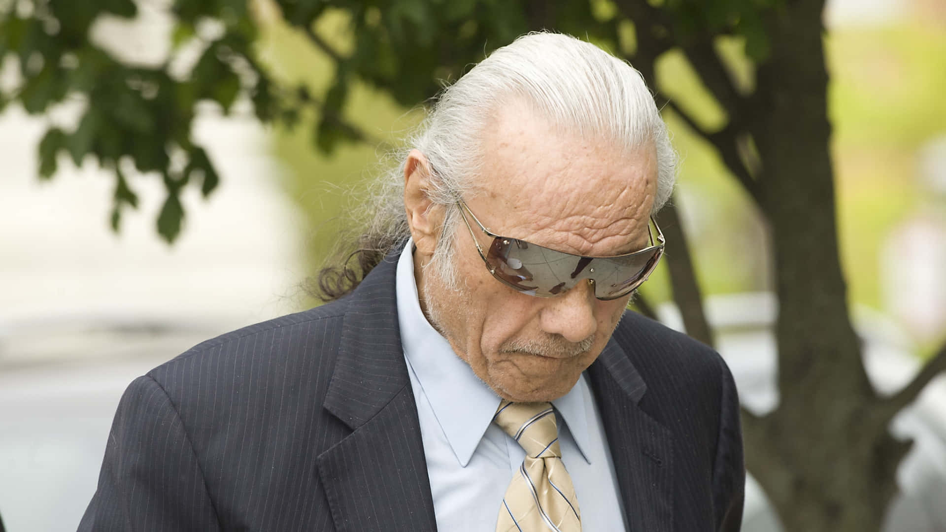 Old Jimmy Snuka Wearing Cool Shades Background