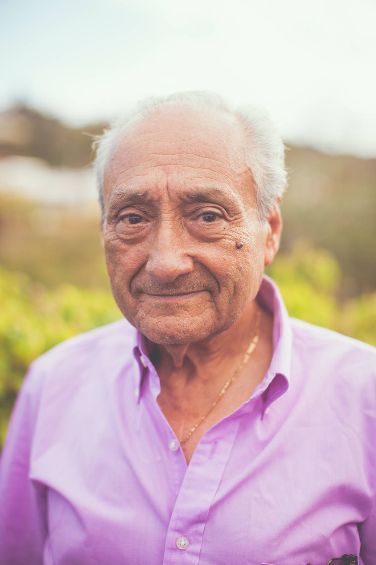 Old Man In Purple Shirt Portrait Background
