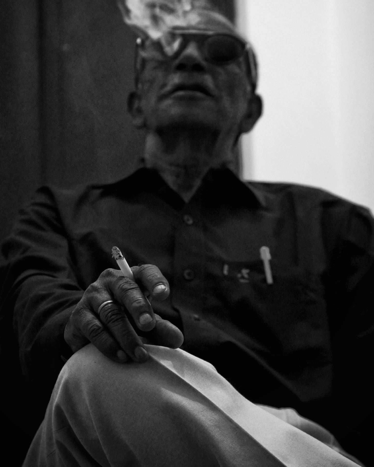Old Man Smoking Grayscale Background