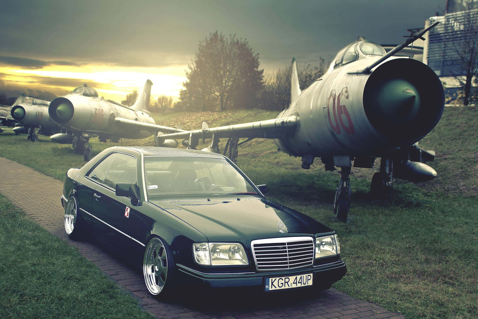 Old Mercedes Benz Parked Beside An Airplane