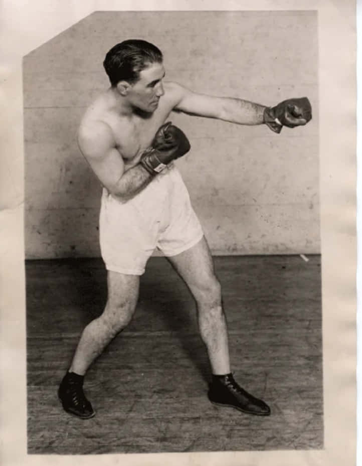 Old Photo Of Johnny Dundee Doing A Boxing Stance Background