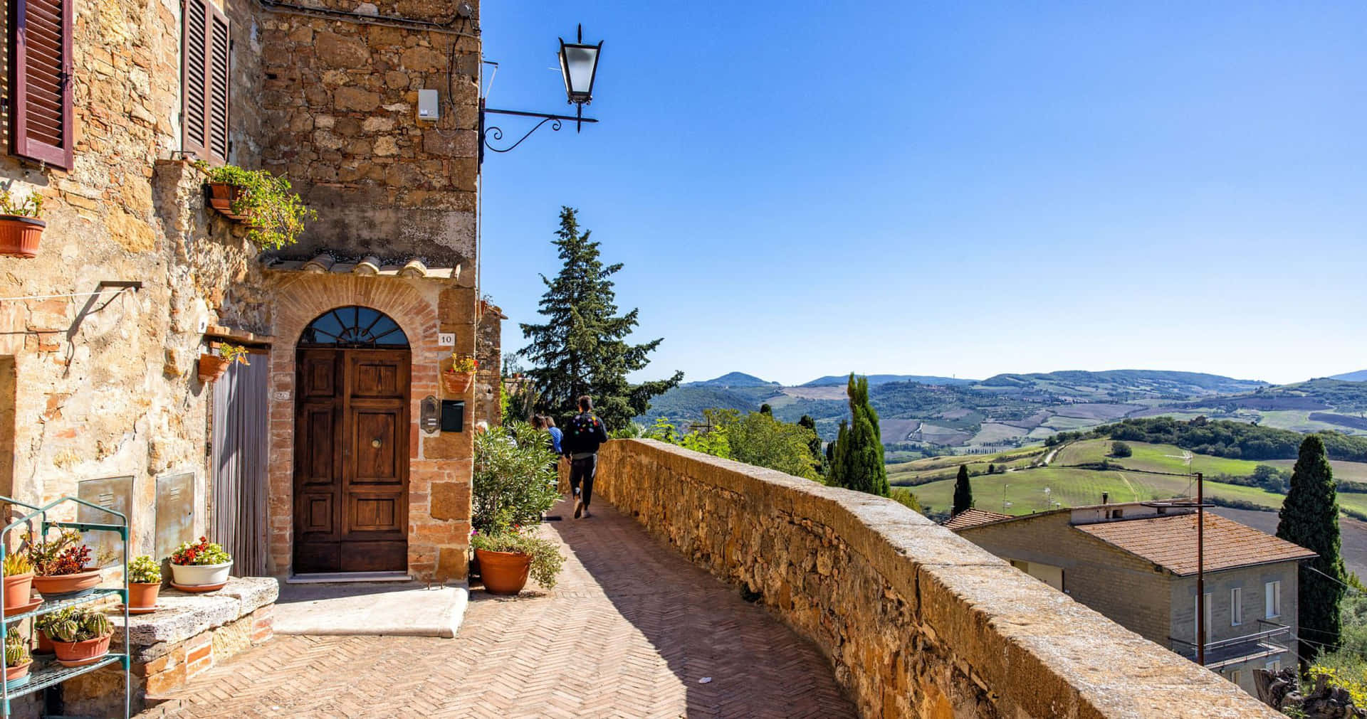 Old Pienza Brick House With Mountain Scenery Background