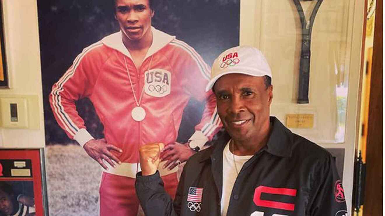 Old Ray Leonard Posing With Photo Of Himself