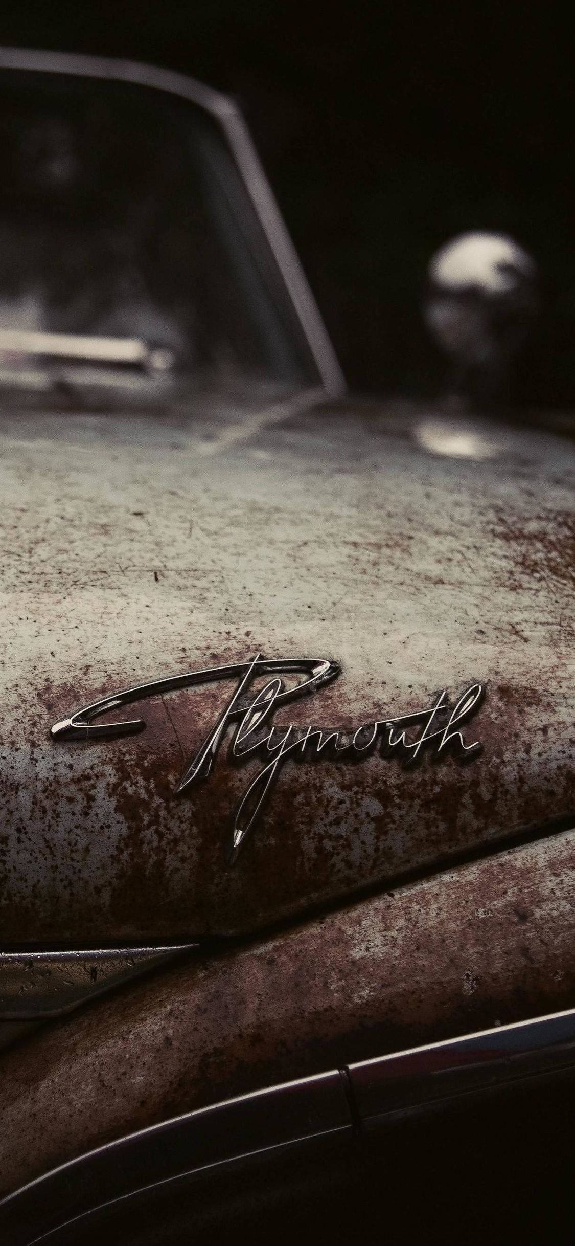 Old Rusty Car Plymouth Logo Phone Background