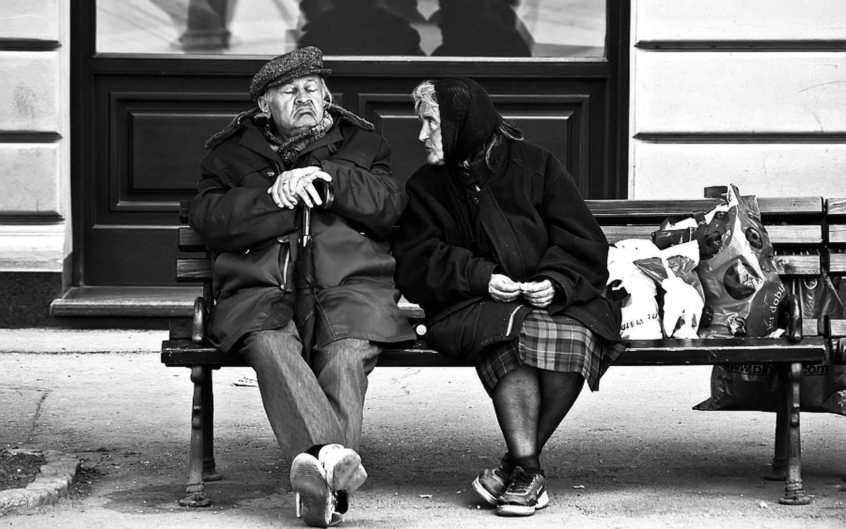 Old Woman And Man In The Waiting Station Background