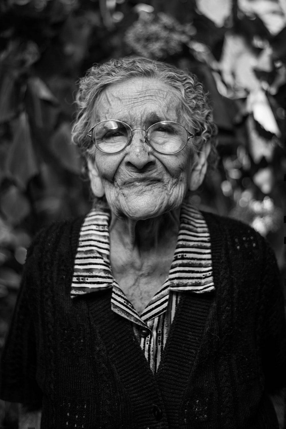 Old Woman In Greyscale Background