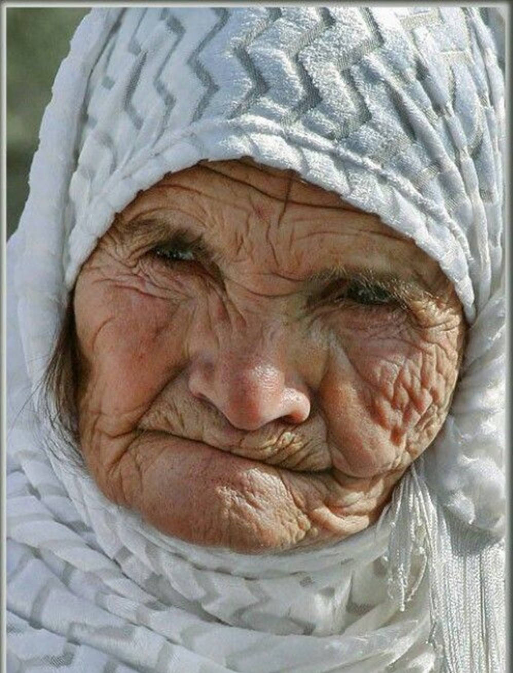 Old Woman With White Headwrap Background