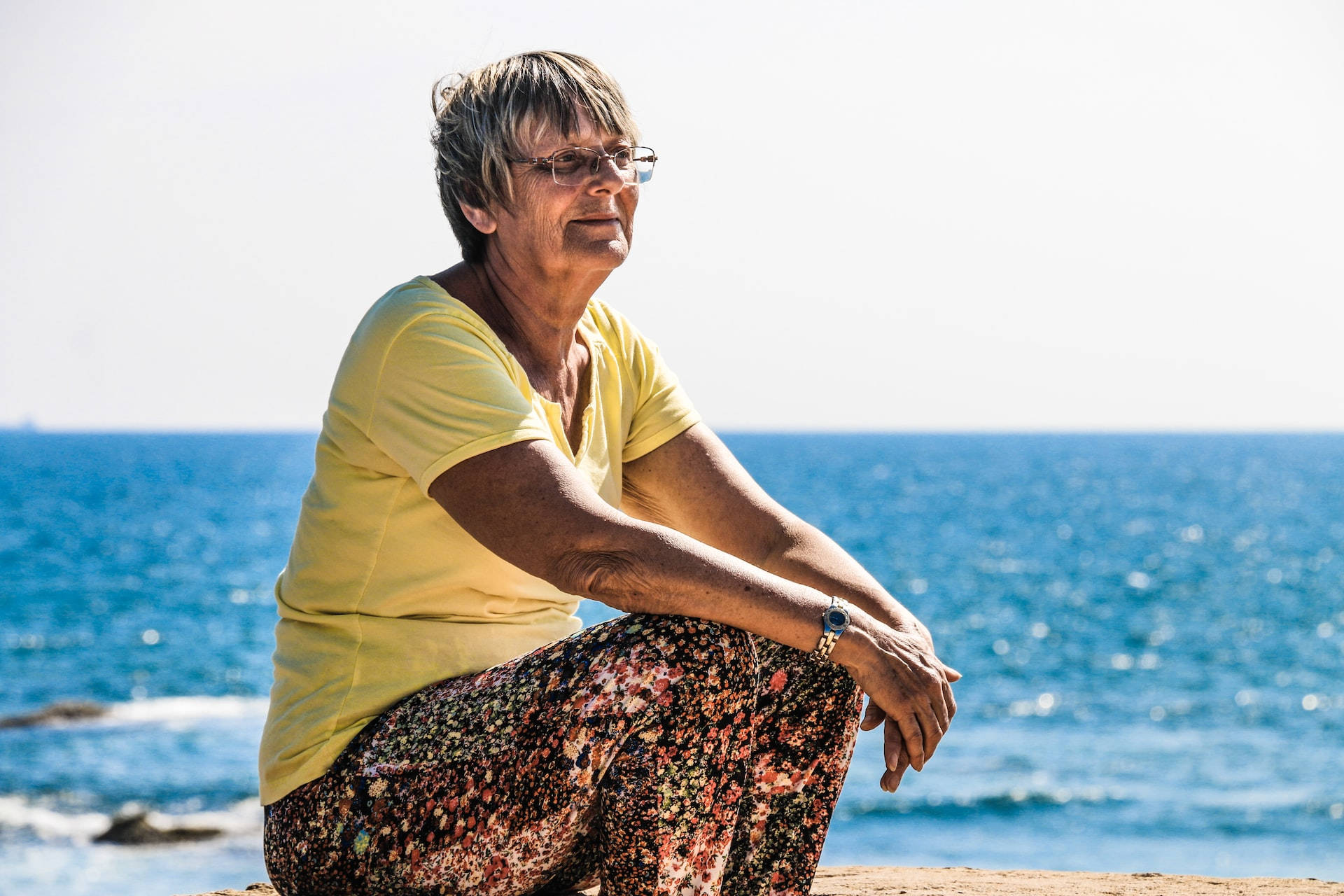 Older Woman By The Sea