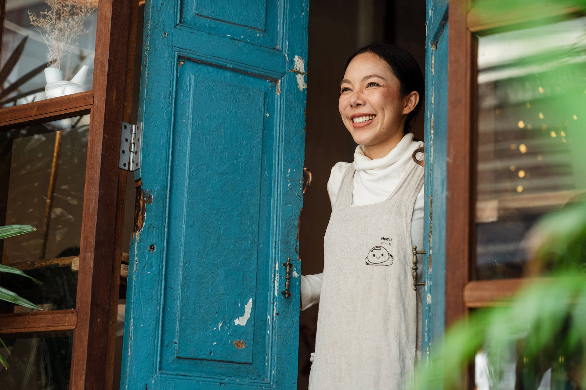 Older Woman Opening The Door Background