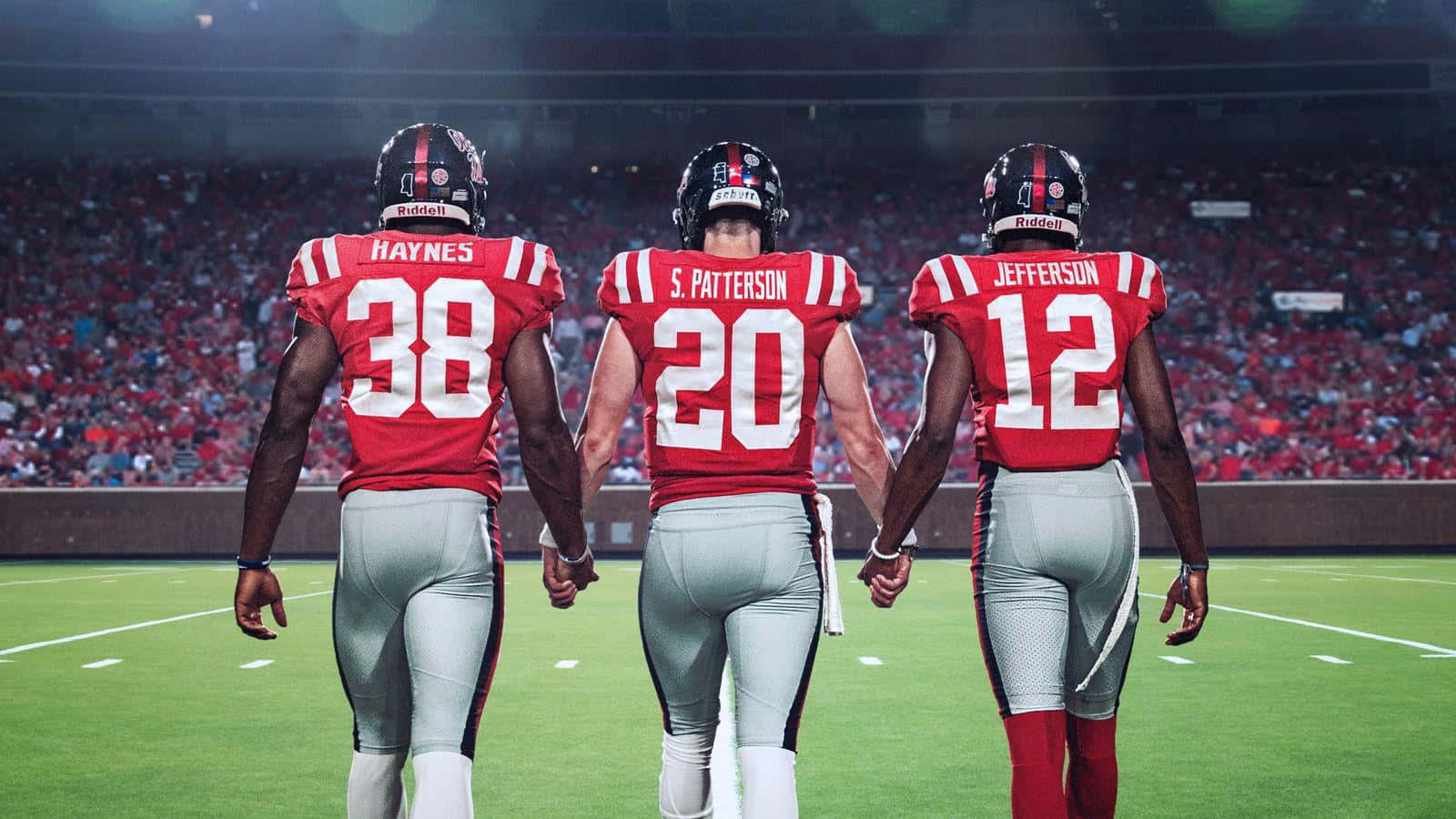 Ole Miss Three Football Players Background