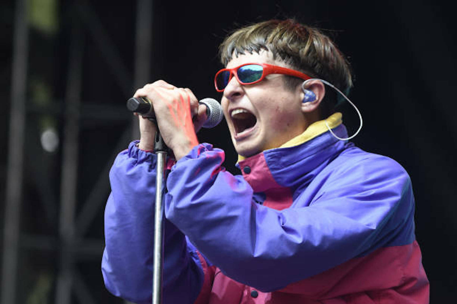 Oliver Tree Singing On Microphone Background