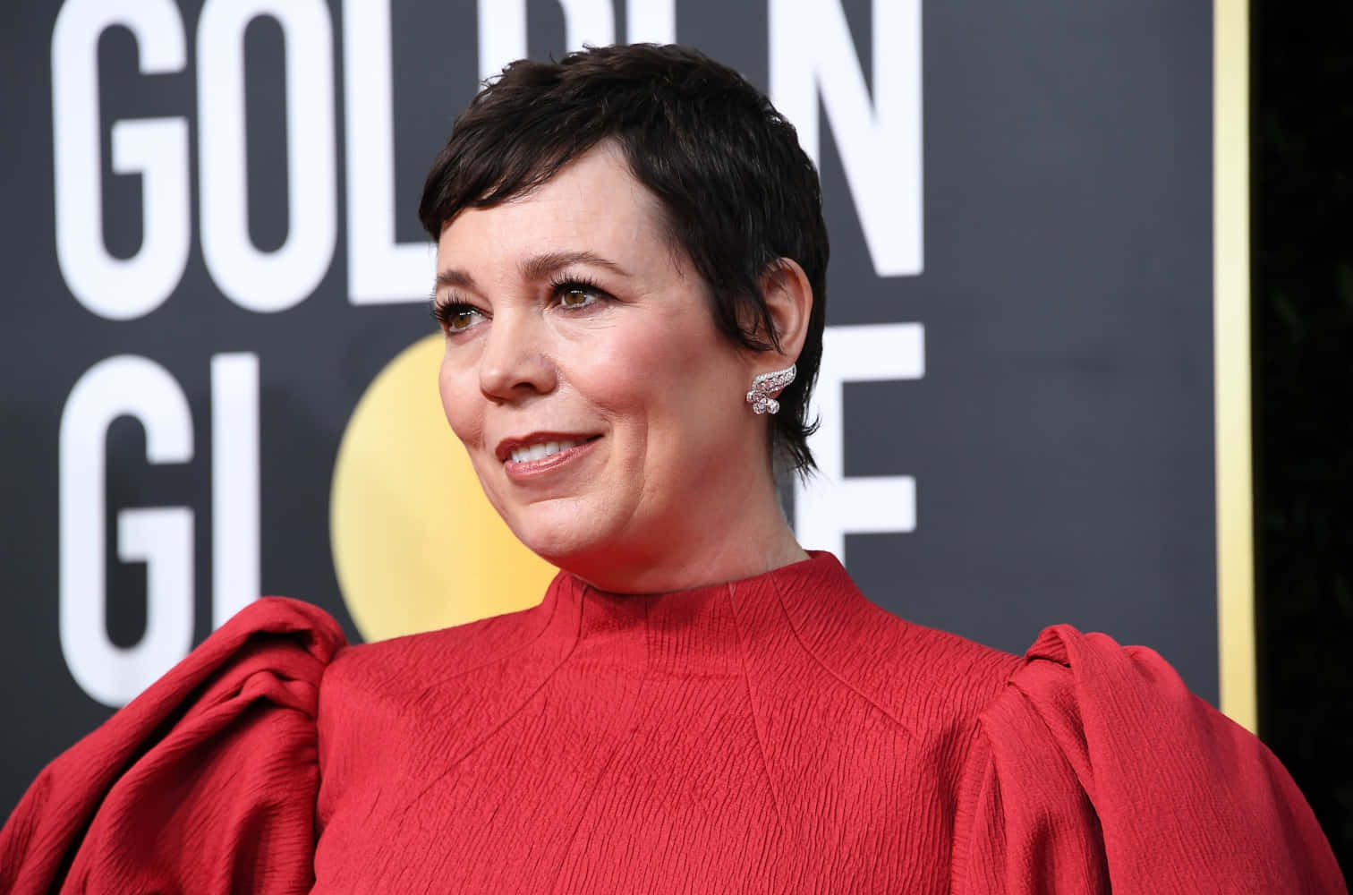 Olivia Colman Glowing In Vibrant Red Dress