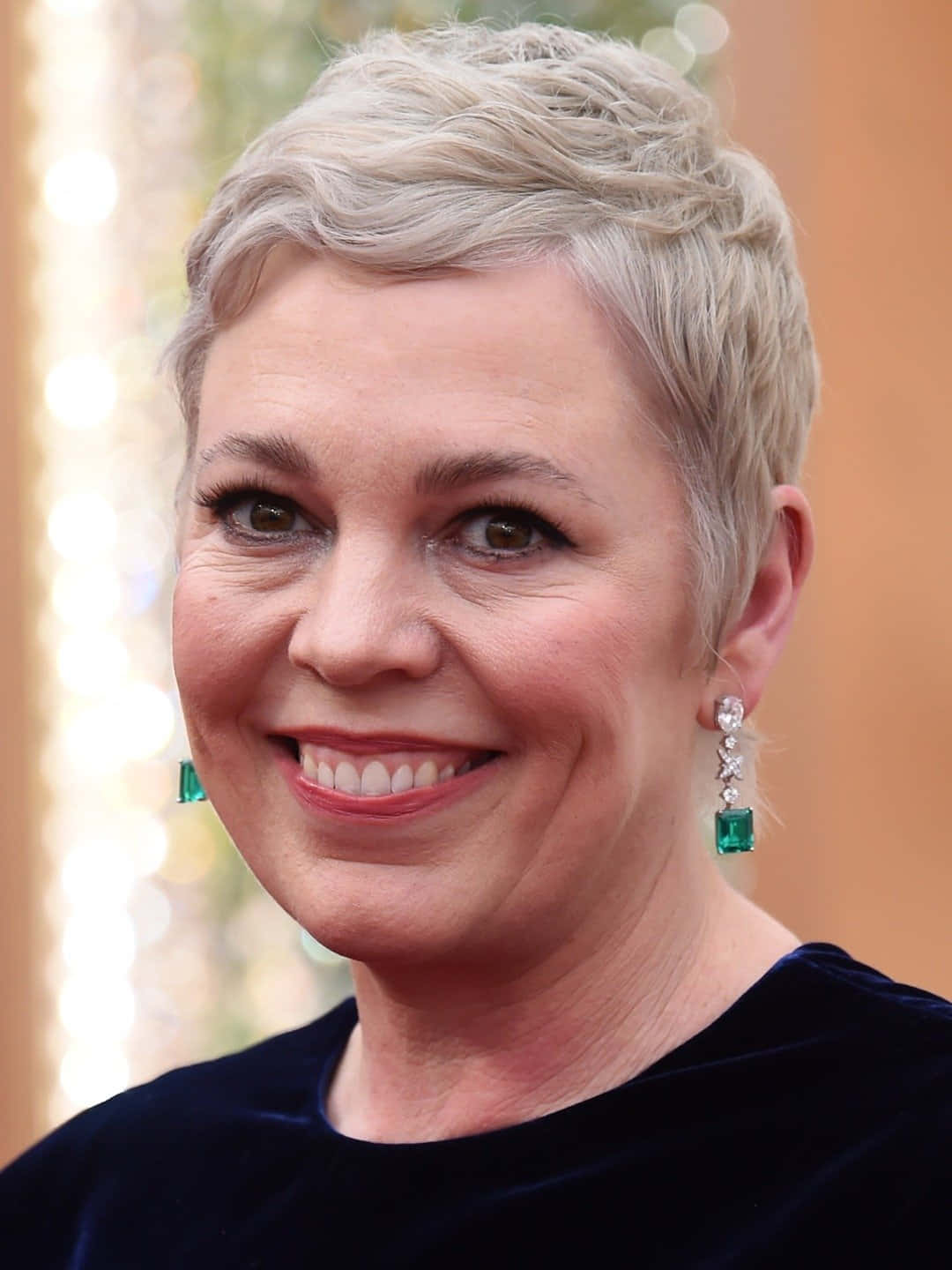 Olivia Colman Glowing On The Red Carpet. Background