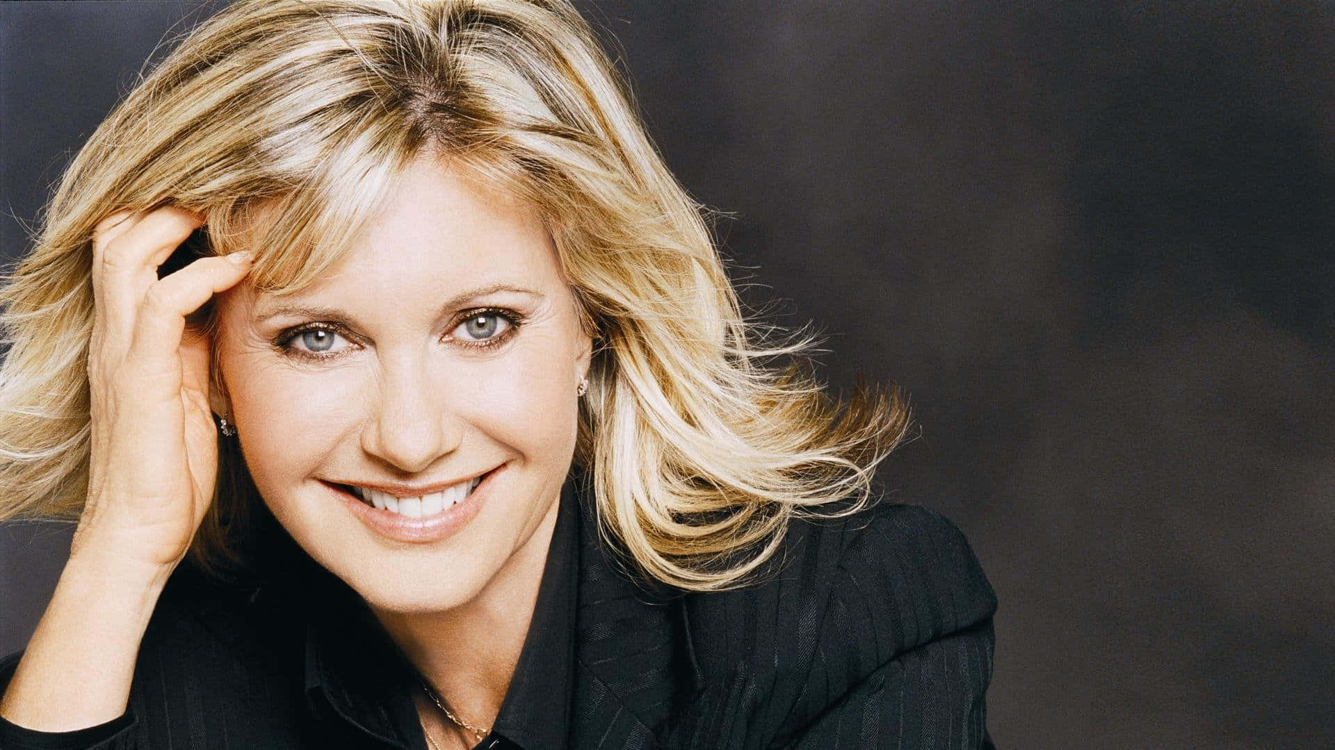 Olivia Newton John Hand In Hair Pose