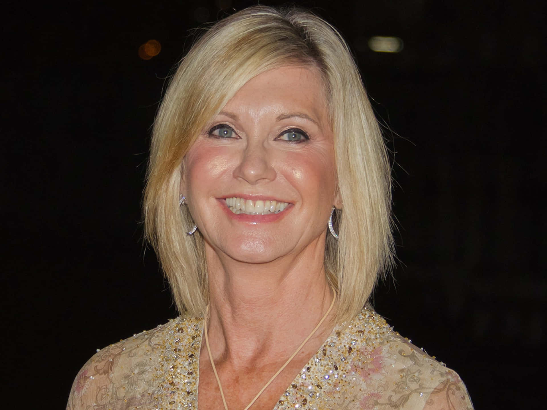 Olivia Newton John In Beige Dress Background