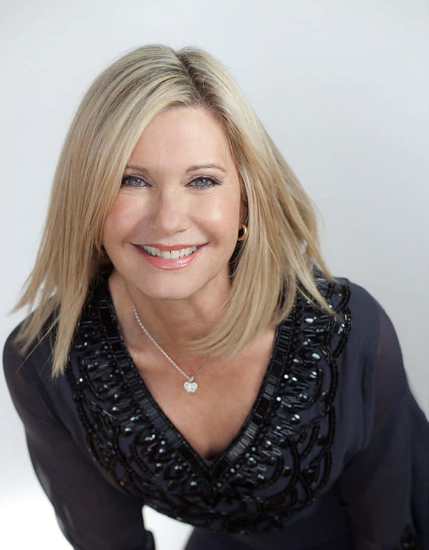 Olivia Newton John In Black Top Background