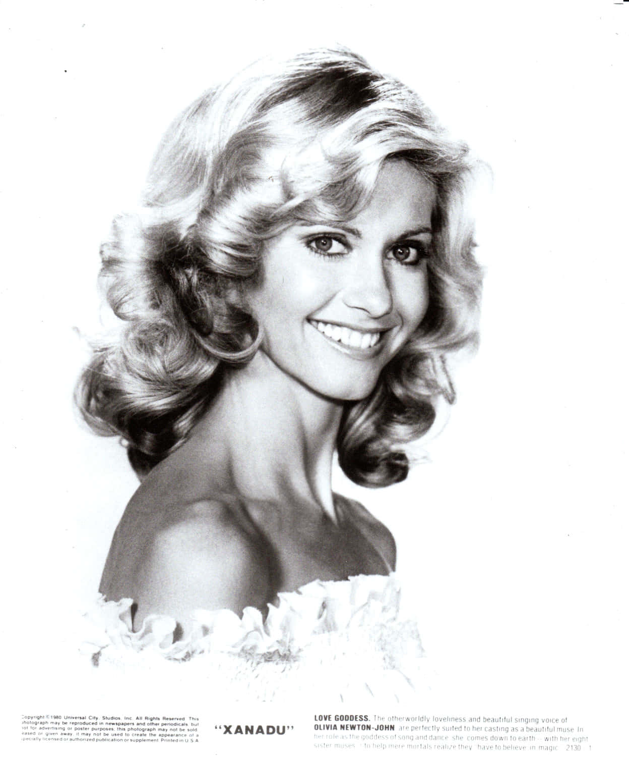 Olivia Newton John In Bright White Backdrop Background