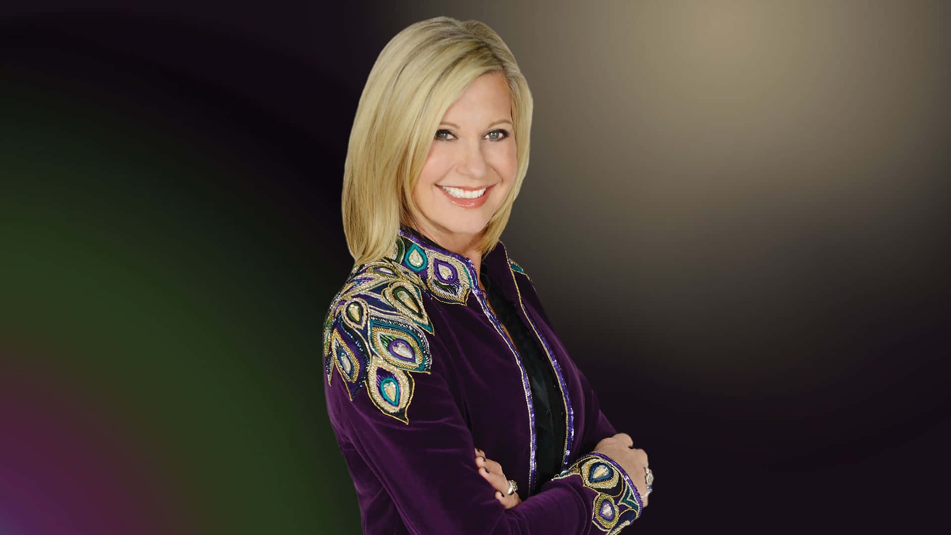 Olivia Newton John In Peacock-inspired Jacket