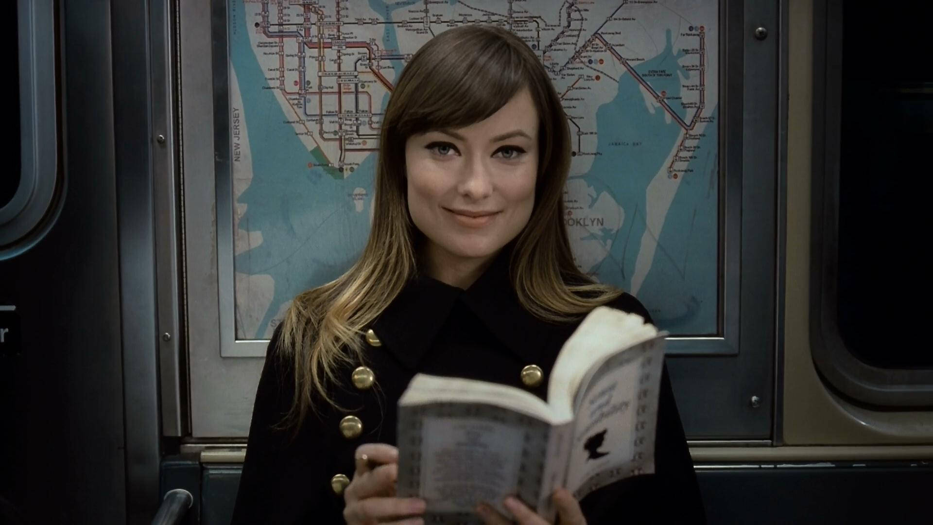 Olivia Wilde Holding A Book Background
