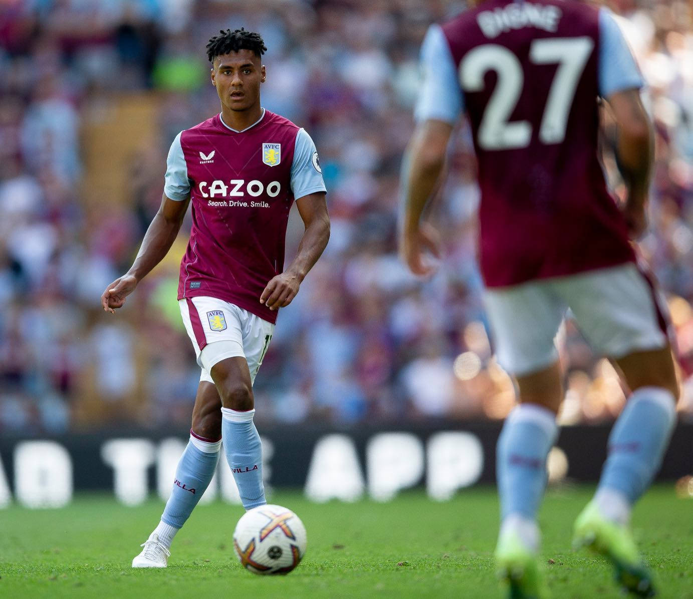 Ollie Watkins Handling The Ball In A Football Match Background