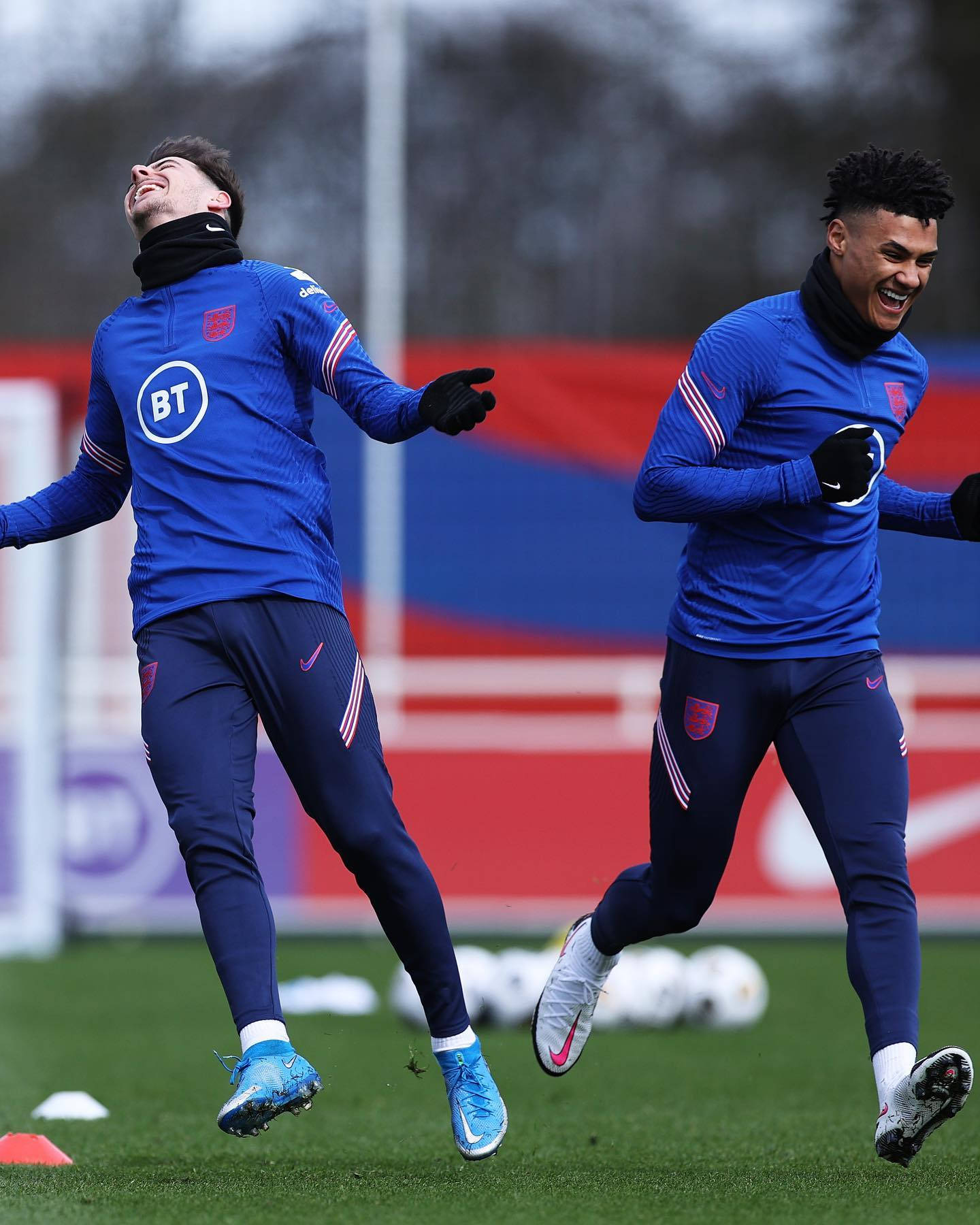 Ollie Watkins Laughing With Teammate Background