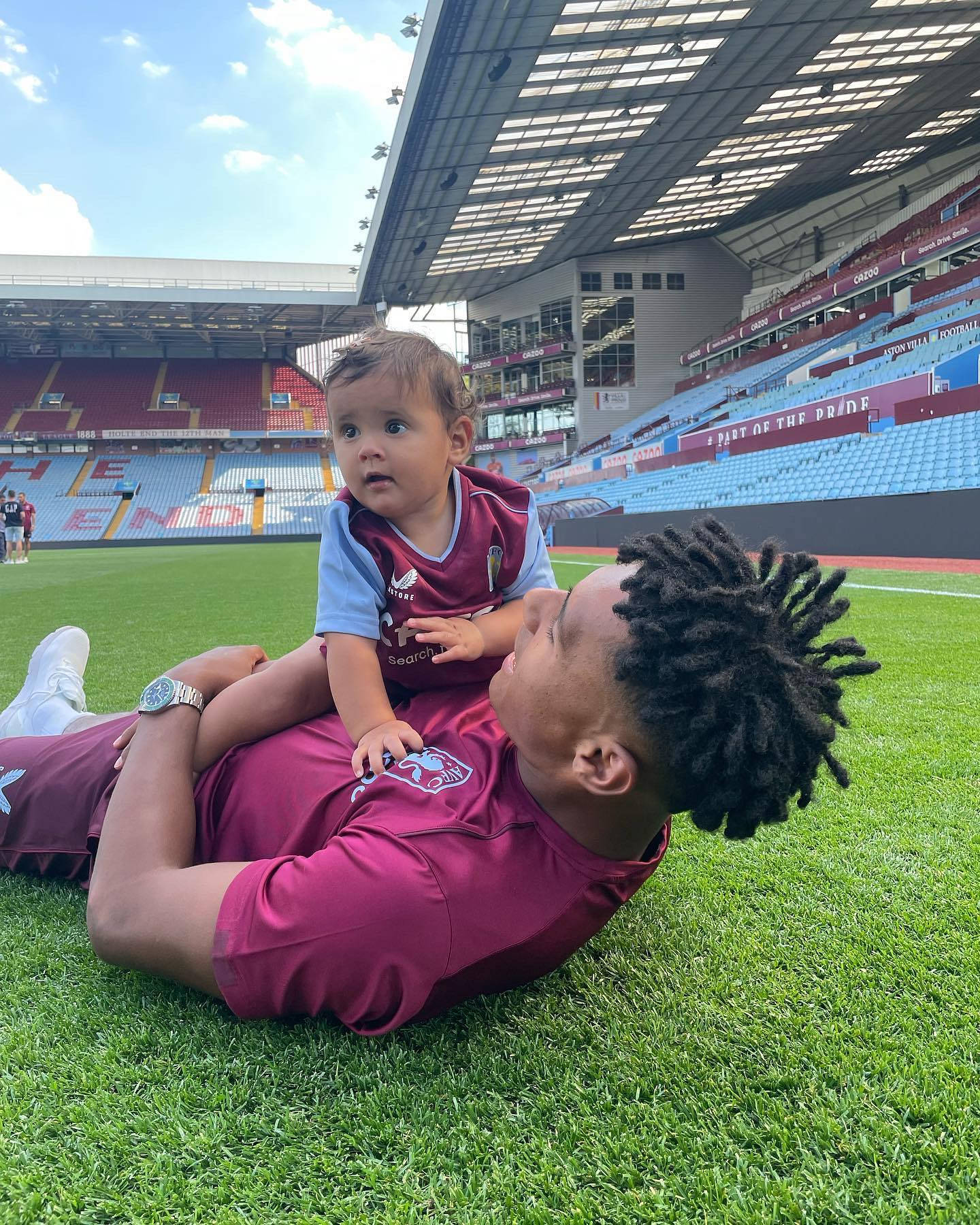 Ollie Watkins Playing With Toddler Background