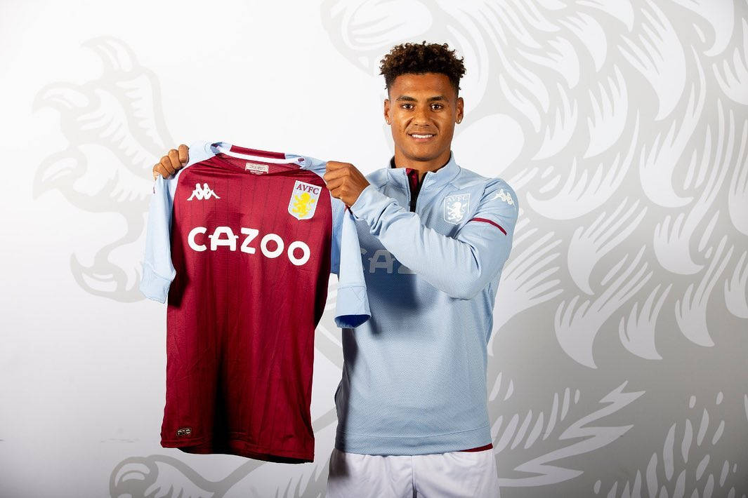 Ollie Watkins Posing With Jersey Background