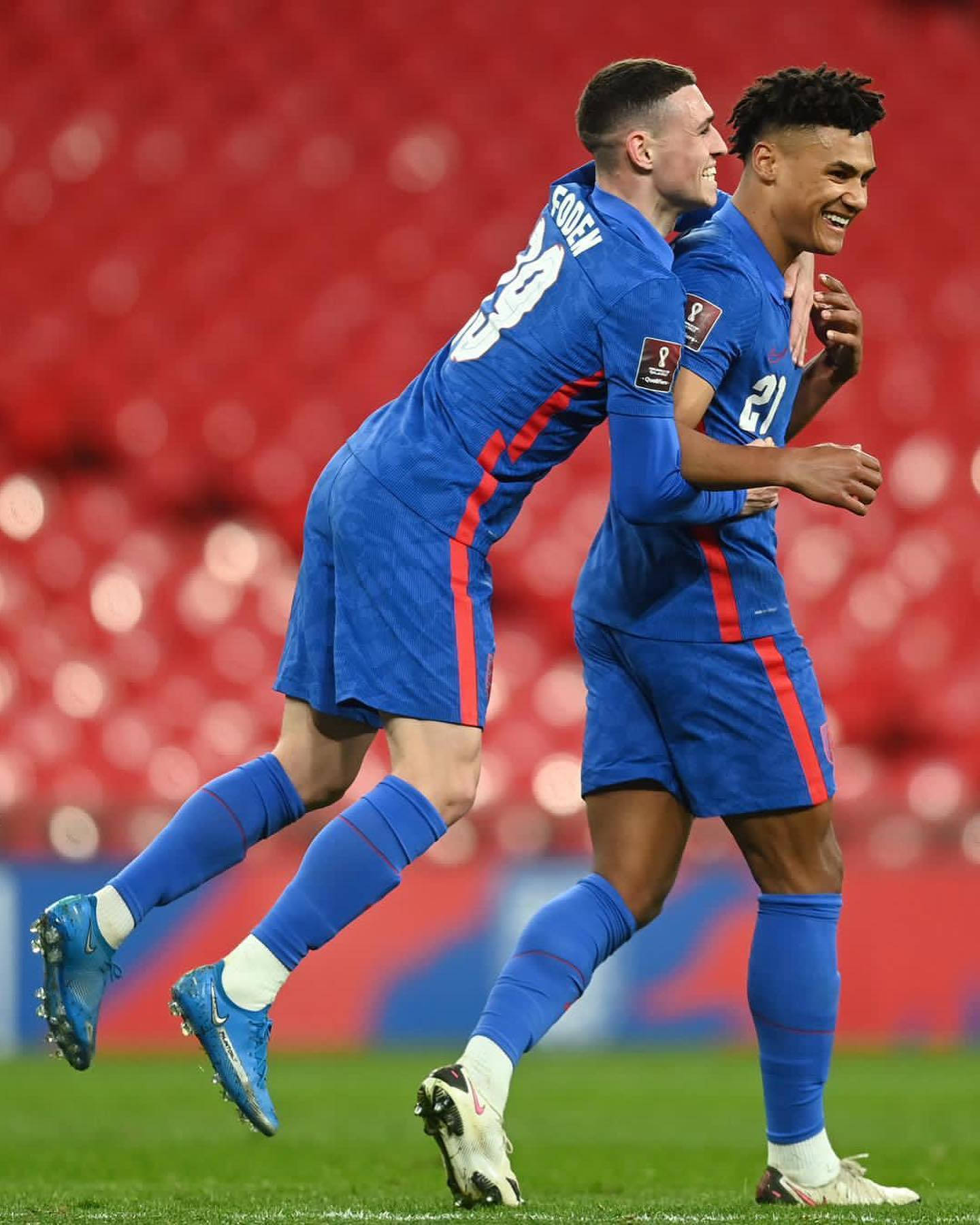 Ollie Watkins Receives Hug From Teammate Background